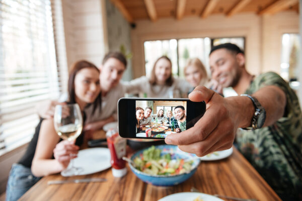 Group,Of,Friends,Having,Dinner,And,Taking,Selfie,With,Smartphone