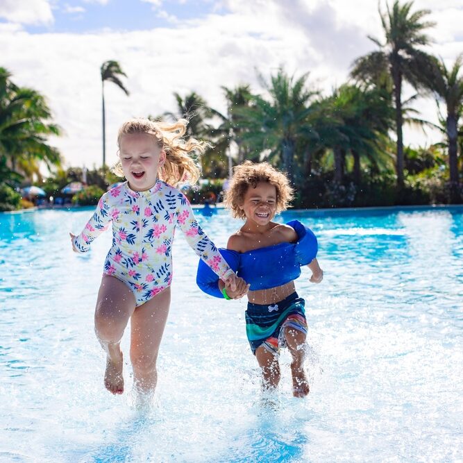 A,Cute,Diverse,Boy,And,Little,Girl,Running,And,Splashing