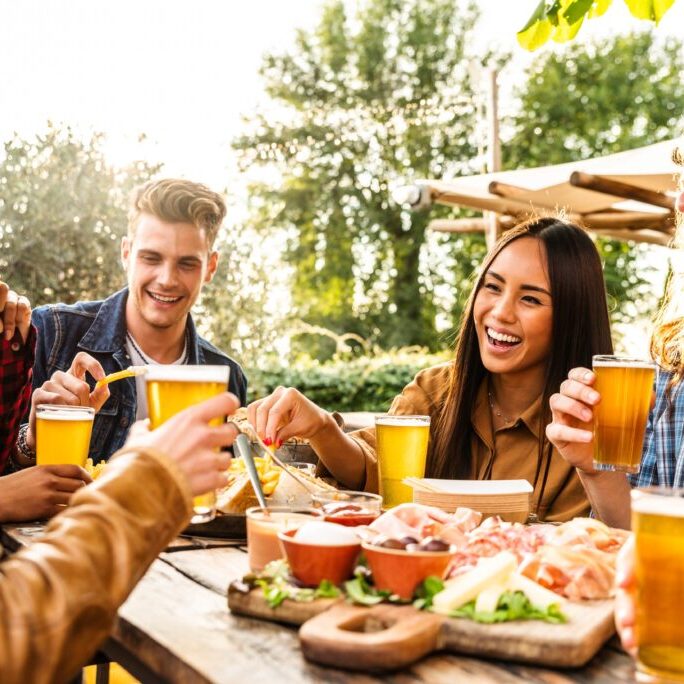 Group,Of,Multi,Ethnic,Friends,Having,Backyard,Dinner,Party,Together