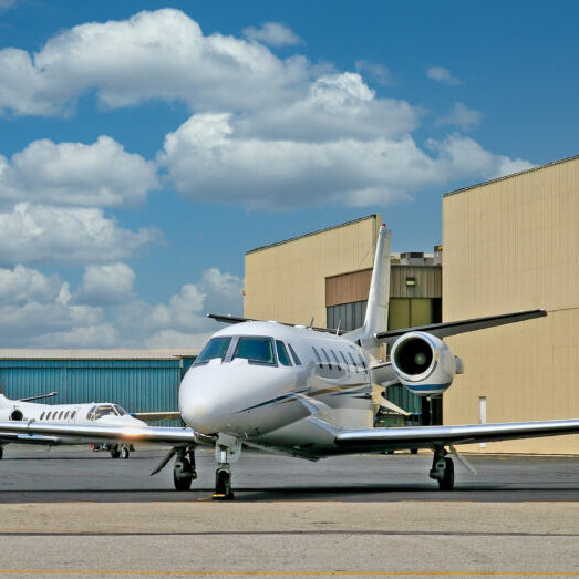A,Small,Private,White,Jet,At,An,Airport